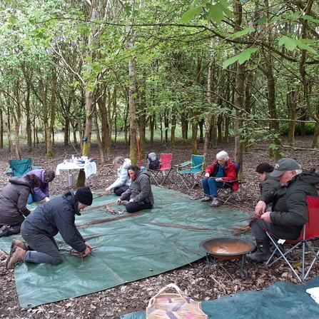 Group of Wild Beings participants willow weaving