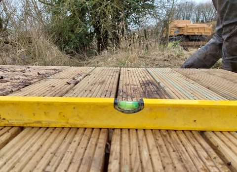 Spirit level on top of boardwalk